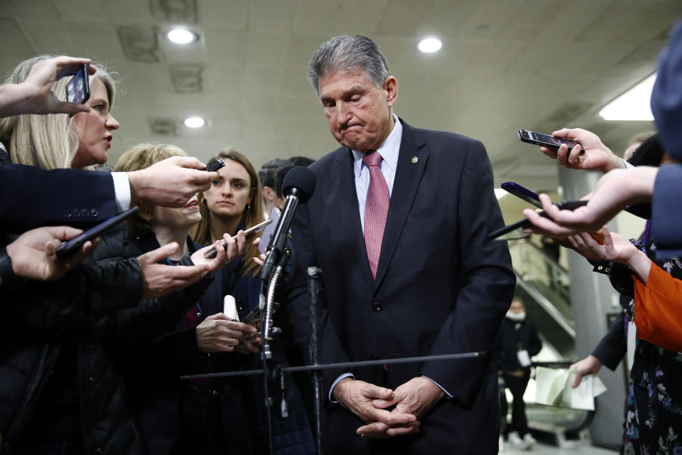 Sen. Joe Manchin, D-W.Va., speaks with reporters after President Donald Trump was acquitted in an impeachment trial on charges of abuse of power and obstruction of Congress on Capitol Hill in Washington, Wednesday, Feb. 5, 2020. (AP Photo/Patrick Semansky)