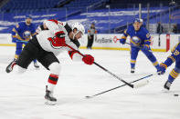 New Jersey Devils forward Pavel Zacha (37) takes a shot during the first period of an NHL hockey game against the Buffalo Sabres, Saturday, Jan. 30, 2021, in Buffalo, N.Y. (AP Photo/Jeffrey T. Barnes)