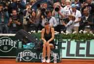 PARIS, FRANCE - JUNE 09: Maria Sharapova of Russia smiles as she celebrates victory in the women's singles final against Sara Errani of Italy during day 14 of the French Open at Roland Garros on June 9, 2012 in Paris, France. (Photo by Matthew Stockman/Getty Images)