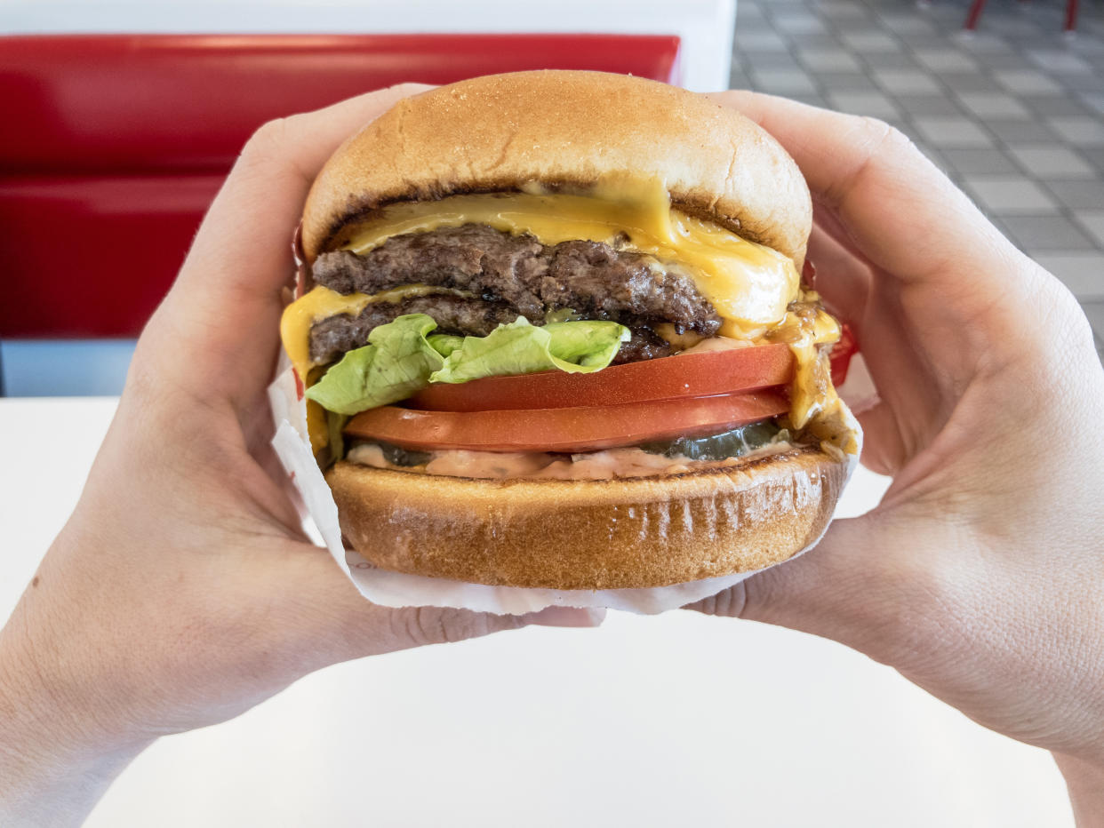 The typical fast food cheeseburger is becoming less popular as consumers become more aware of the climate effects of meat production. (Getty Images)