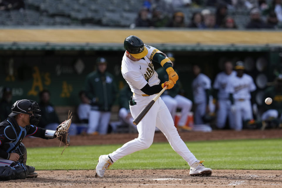 Oakland Athletics' Brent Rooker hits a three-run home run against the Miami Marlins during the third inning of a baseball game Saturday, May 4, 2024, in Oakland, Calif. (AP Photo/Godofredo A. Vásquez)