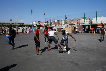 African migrants play football near their makeshift house on the outskirts of Casablanca, Morocco September 5, 2018. REUTERS/Youssef Boudlal