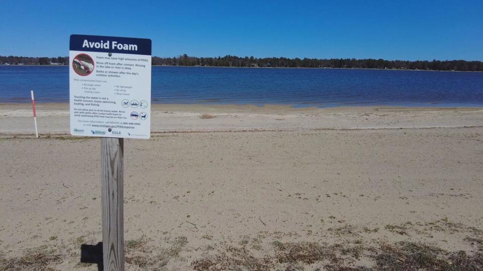 PHOTO: The beaches along Van Etten Lake in Oscoda, Michigan, are dotted with foam advisories warning of exposure to PFAS, per- and polyfluoroalkyl substances that are harmful to human health. (ABC News)