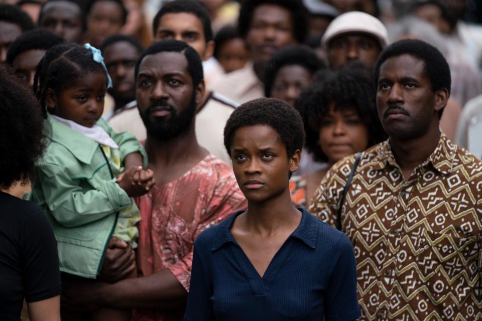 SMALL AXE, from left: Letitia Wright (front), Gershwyn Eustache Jr. (right), Mangrove', (Season 1, ep. 101, aired Nov. 20, 2020). photo: Des Willie / ©Amazon / Courtesy Everett Collection