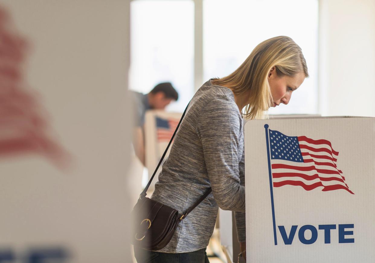 woman voting at polling station