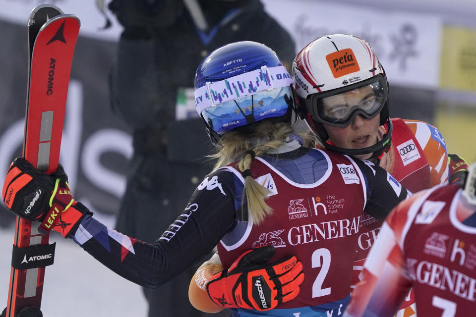 United States' Mikaela Shiffrin, left, winner of an alpine ski World Cup women's slalom race, hugs Slovakia's Petra Vlhova, in Levi, Finland, Sunday, Nov. 12, 2023. (AP Photo/Giovanni Auletta)