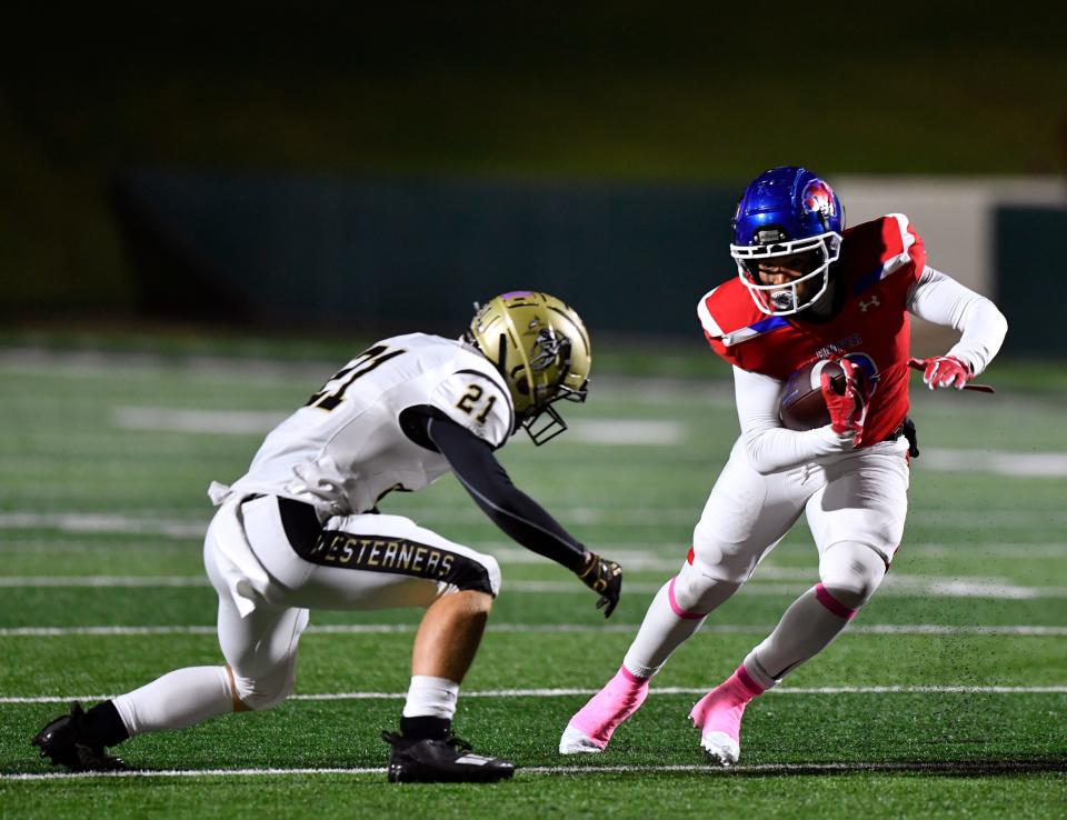 Cooper wide receiver D'Andre Ralston sidesteps away from Lubbock High linebacker Jackson Cude during the Oct. 28 game at Shotwell Stadium.