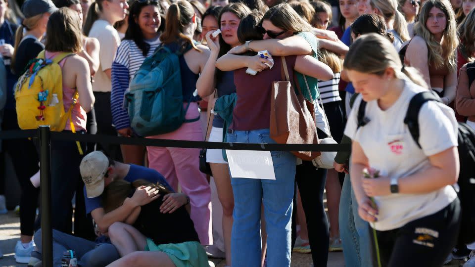 Students mourn the loss of two fellow students at the University of Georgia's Tate Plaza on Monday, February 26, 2024. - Joshua L. Jones/Online Athens/USA Today Network