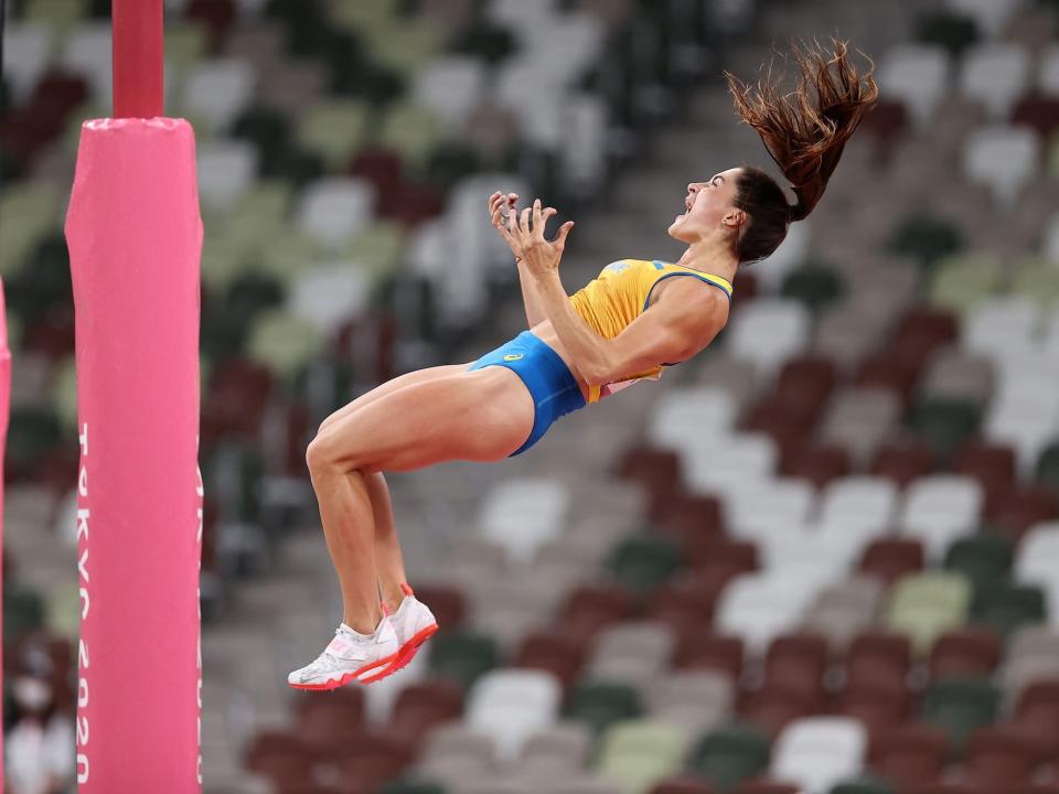 Maryna Kylypko of Team Ukraine yells while falling down in the pole vault.