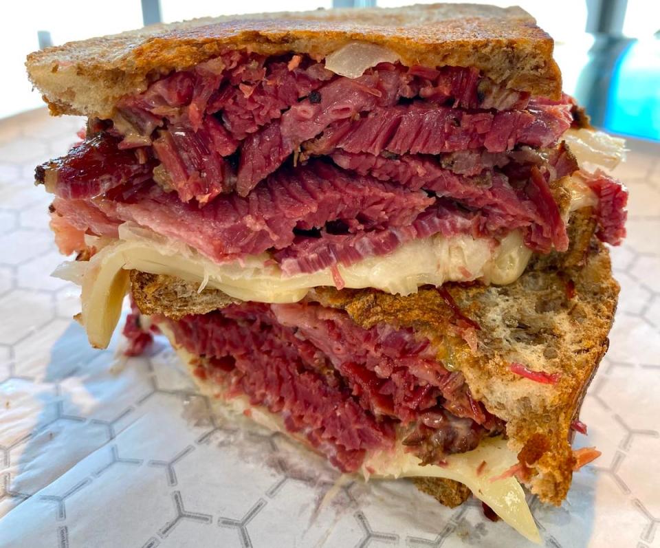 Meshugganah’s popular pastrami and corned beef sandwiches are finding a home at Joan’s Bakery.