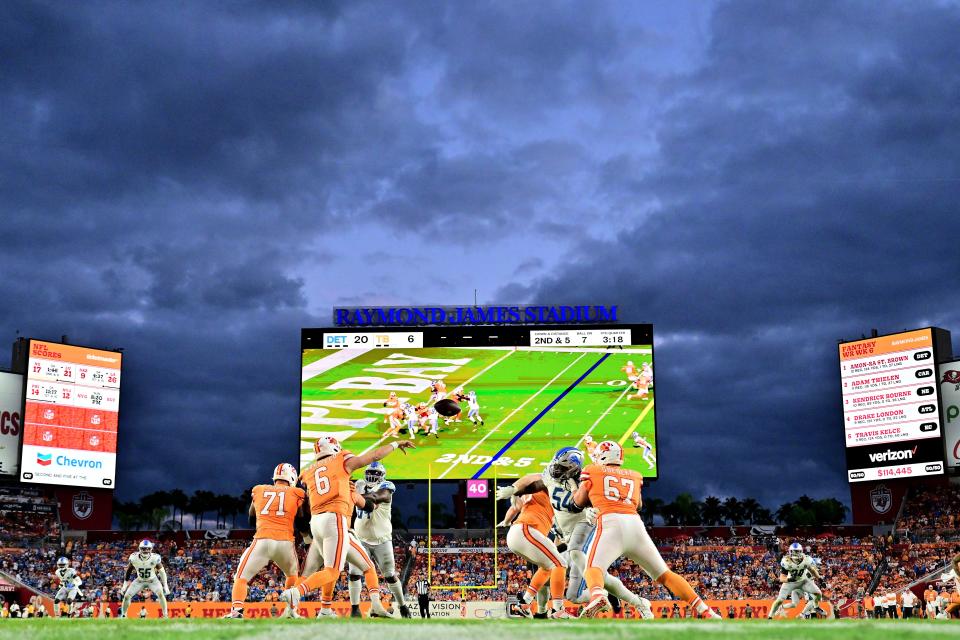 Baker Mayfield of the Tampa Bay Buccaneers attempts a pass during the fourth quarter against the Detroit Lions at Raymond James Stadium on Oct. 15, 2023, in Tampa, Florida.