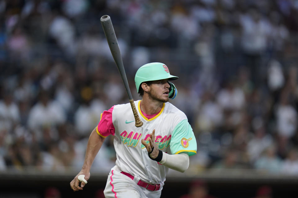 San Diego Padres' Wil Myers watches his home run during the fourth inning of the team's baseball game against the Arizona Diamondbacks, Wednesday, Sept. 7, 2022, in San Diego. (AP Photo/Gregory Bull)