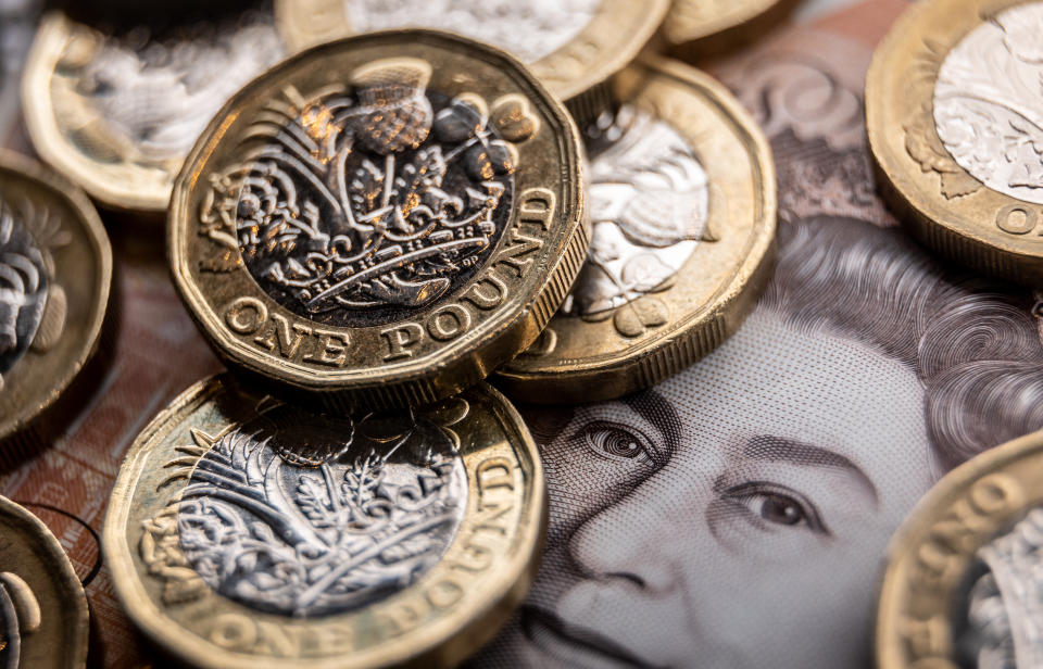 pound  BATH, UNITED KINGDOM - SEPTEMBER 25: In this photo illustration, British GDP £1 coins and bank notes are pictured on September 25, 2022 in Bath, England. The UK pound sterling fell to its lowest level against the U.S. dollar since 1985, as concerns grew at the prospect of a surge in the UK government borrowing to pay for the multiple tax cuts, announced in Conservative Party chancellor Kwasi Kwarteng’s mini-budget. The fall in the value of sterling is also contributing to the UK's cost of living crisis, as inflation hits a near-30-year high. (Photo Illustration by Matt Cardy/Getty Images)