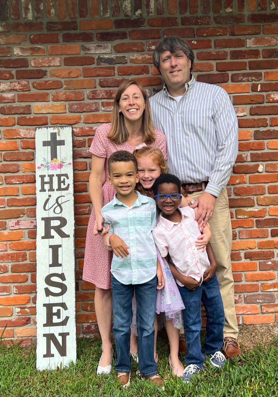 Matt and Jessica Bush pose in Jacksonville with their children: Sophie, 8, Elijah, 7, and Ezekyal, 5. The Bushes founded an orphanage in Haiti and adopted Ezekyal there but he has not been back since he was 8 months old because of ongoing civil unrest.