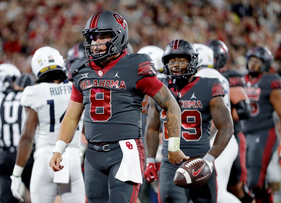 OU quarterback Dillon Gabriel (8) celebrates a touchdown in the first half of a 59-20 win against West Virginia on Saturday in Norman.