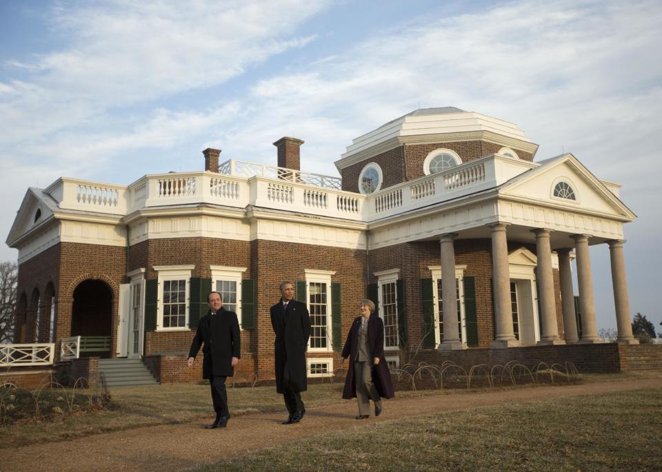 President Barack Obama, center, and French President Francois Hollande, left, tour the grounds of Monticello, President Thomas Jefferson's estate, Monday, Feb. 10, 2014, in Charlottesville, Va. Leading the tour is Leslie Bowman, right, president of the Thomas Jefferson Foundation. (AP Photo/Pablo Martinez Monsivais)