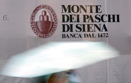 A panel with logo of Monte dei Paschi di Siena bank is seen in downtown Siena, November 5, 2014. REUTERS/Giampiero Sposito
