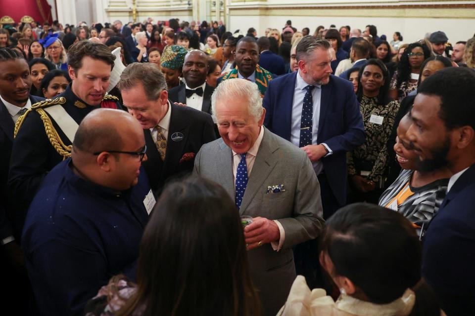 King Charles III speaks with guests during a reception on his 75th birthday to celebrate nurses and midwives working in the UK, as part of the NHS 75 celebrations, at Buckingham Palace (PA)