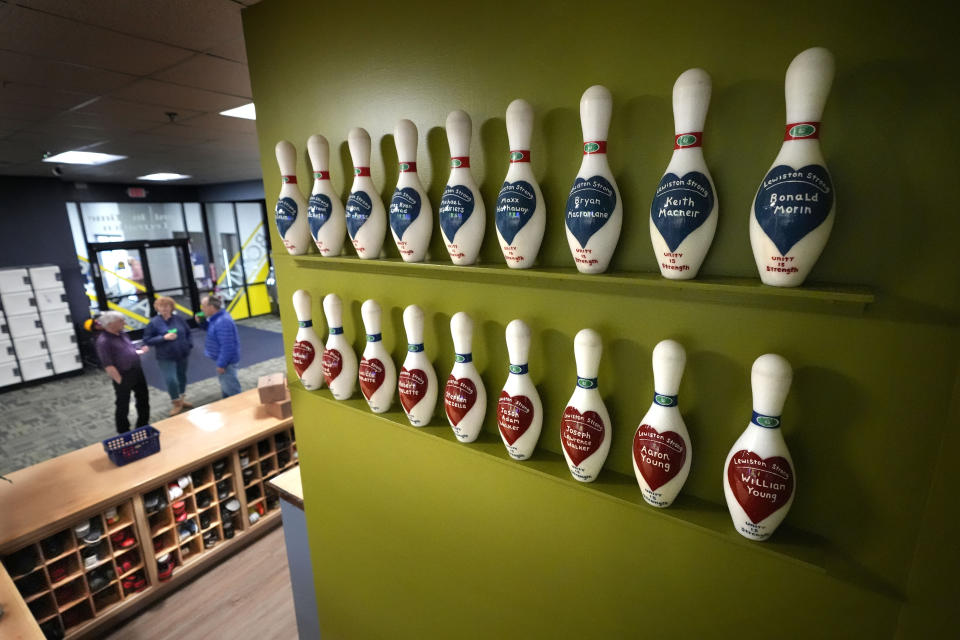 Bowling pins labeled for each of the 18 victims of the Oct. 25, 2023, mass shooting are displayed at Just In Time Recreation, Wednesday, May 1, 2024, in Lewiston, Maine. The bowling alley, where eight people were killed, was scheduled to reopen Friday, May 3. An additional 10 people were killed at nearby bar. (AP Photo/Robert F. Bukaty)