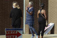 Inspector Lola Roberts declares that the voting center at Terre Haute North High School is closed at 6 p.m. on Tuesday, June 2, 2020 in Terre Haute, Ind. Roberts allowed those in line to vote. ( Joseph C. Garza/Tribune-Star via AP)