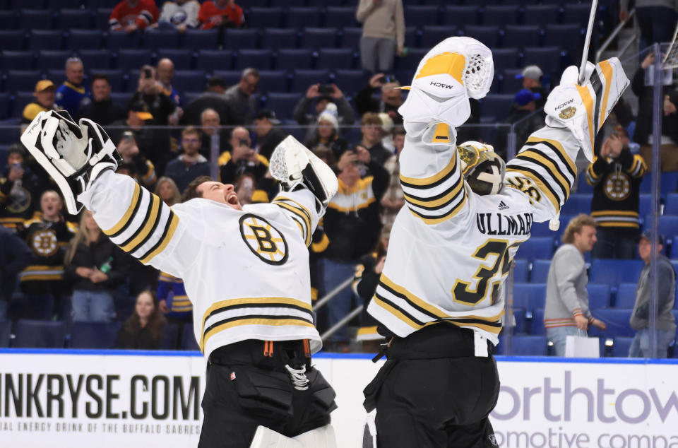 BUFFALO, NEW YORK - NOVEMBER 14: Jeremy Swayman #1 of the Boston Bruins congratulates Linus Ullmark #35 following their 5-2 victory against the Buffalo Sabres in an NHL game on November 14, 2023 at KeyBank Center in Buffalo, New York. (Photo by Bill Wippert/NHLI via Getty Images)
