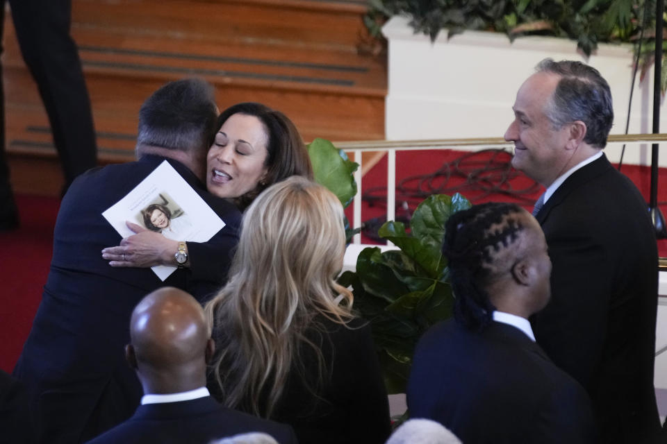 Vice President Kamala Harris and country music star Garth Brooks embrace during a tribute service for former first lady Rosalynn Carter, at Glenn Memorial Church, Tuesday, Nov. 28, 2023, in Atlanta, Tuesday, Nov. 28, 2023, flanked by Trisha Yearwood and second gentleman Doug Emhoff. (AP Photo/Andrew Harnik)