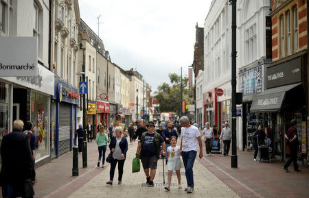 People walk along Chatham High Street in Chatham, Britain, August 8, 2017. REUTERS/Hannah McKay