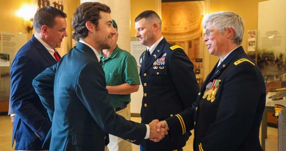 Ryan Blaney greets Army chaplain Maj. Joanna Forbes at Arlington National Cemetery