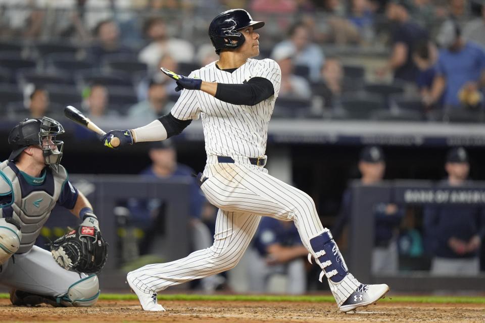 New York Yankees' Juan Soto follows through on a home run against the Seattle Mariners uring the sixth inning of a baseball game Wednesday, May 22, 2024, in New York. (AP Photo/Frank Franklin II)