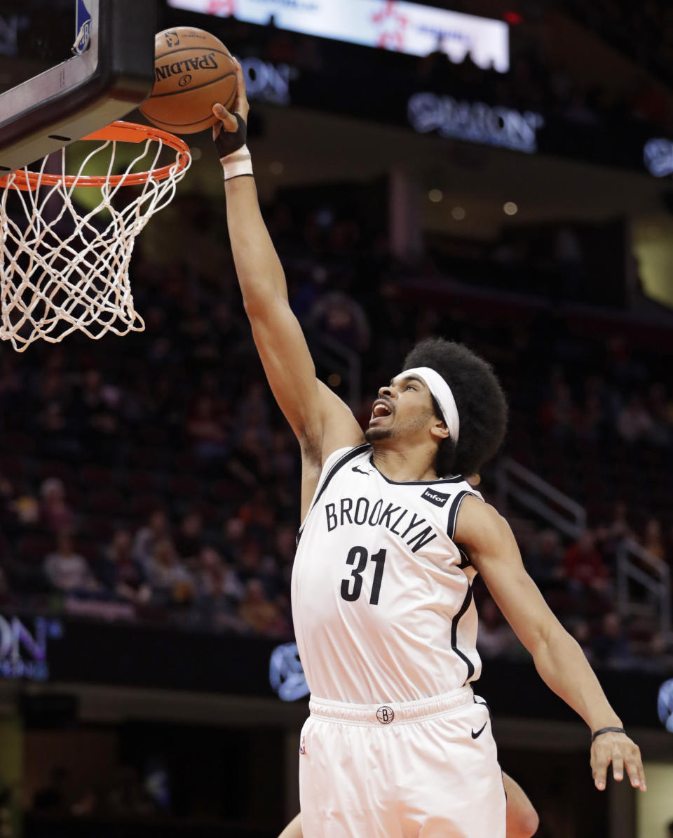 Brooklyn Nets' Jarrett Allen dunks against the Cleveland Cavaliers in the first half of an NBA basketball game, Wednesday, Feb. 13, 2019, in Cleveland. (AP Photo/Tony Dejak)