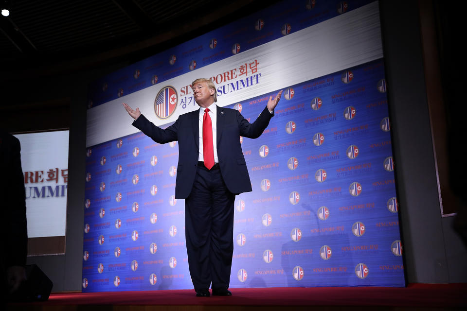 <p>President Donald Trump answers a final question while departing a press conference following his historic meeting with North Korean leader Kim Jong-un June 12, 2018 in Singapore. Trump described his meeting with Kim as “better than anyone could have expected.” (Photo: Win McNamee/Getty Images) </p>