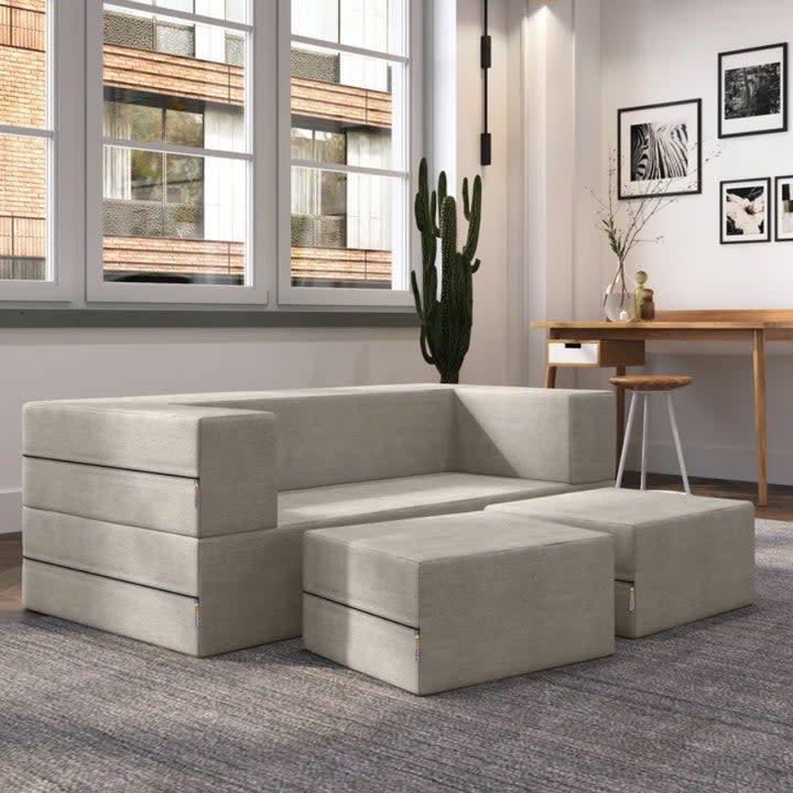 grey cubic couch with removable cushions