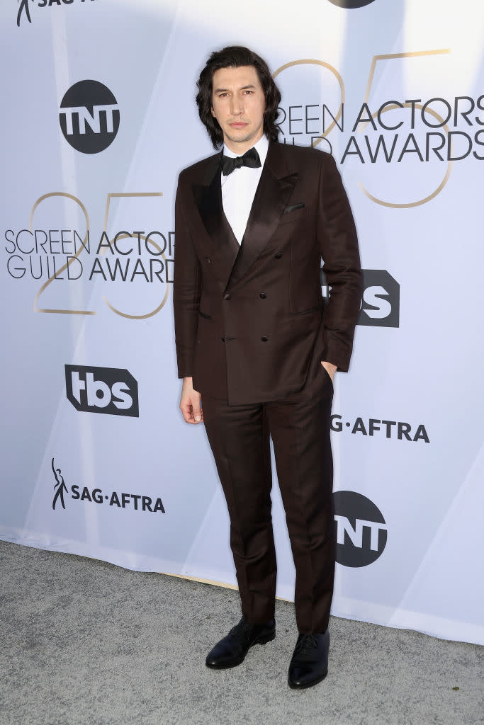 Adam Driver on the red carpet at the Screen Actors Guild (SAG) Awards, wearing a dark suit with a bow tie