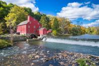 <p>The historic, bright red mill in Clinton, New Jersey is a bright spot on the Raritan River. </p>
