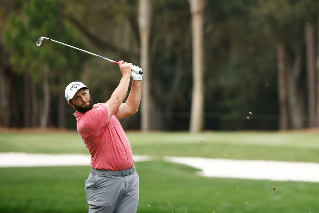 PONTE VEDRA BEACH, FLORIDA - MARCH 14: Jon Rahm of Spain plays a golf approach shot on the seventh hole during the final round of THE PLAYERS Championship on the Stadium Course at TPC Sawgrass on March 14, 2022 in Ponte Vedra Beach, Florida. (Photo by Jared C. Tilton/Getty Images)