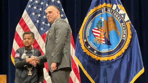 PHOTO: Adam Colon, the chief of police of Franklin, Ohio, shakes hands with Devarjaye 'DJ' Daniel during a ceremony where DJ was named an honorary officer of the Franklin Police Division. (Franklin Ohio Police Department)