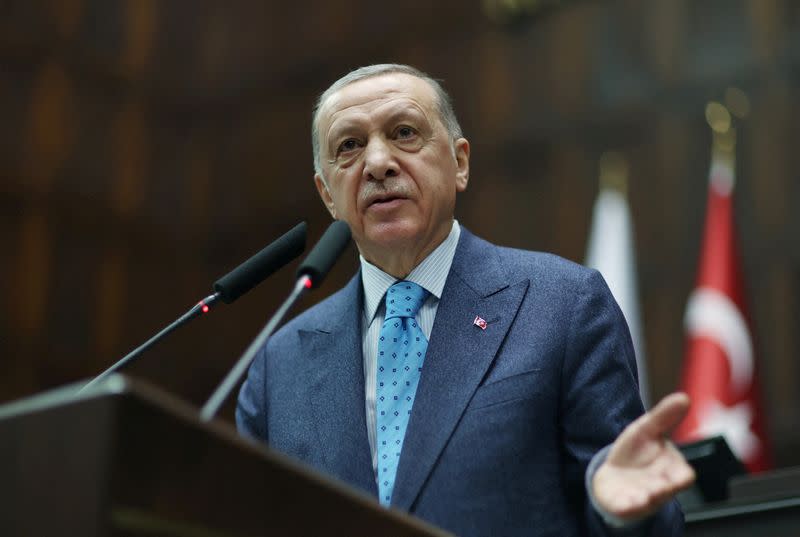 FILE PHOTO: Turkish President Erdogan addresses lawmakers of his AK Party during a meeting at the parliament in Ankara