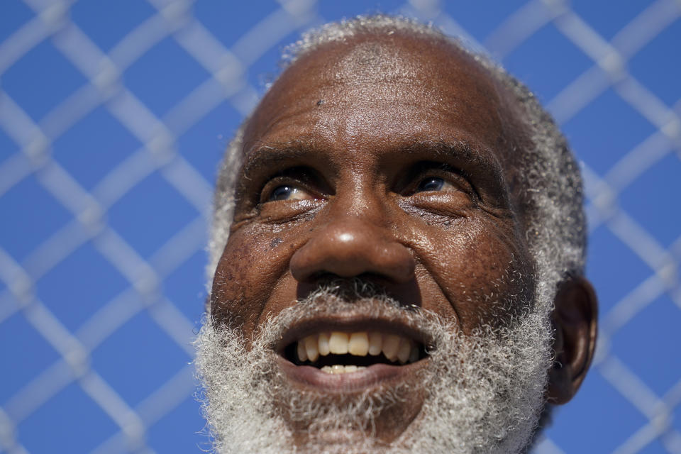 Earl Wilson smiles as he watches a tennis match between fellow San Quentin State Prison inmates and a group of visiting players in San Quentin, Calif., Saturday, Aug. 13, 2022. (AP Photo/Godofredo A. Vásquez)