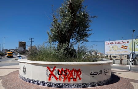 FILE PHOTO: Crossed out logo of USAID is seen in Ramallah, in the Israeli-occupied West Bank