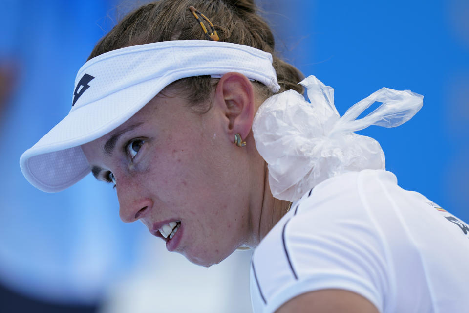 Elise Mertens, of Belgium, rests a bag of ice on her neck during a tennis†match against Ekaterina Aleksandrova, of the Russian Olympic Committee, at the 2020 Summer Olympics, Sunday, July 25, 2021, in Tokyo, Japan. (AP Photo/Patrick Semansky)
