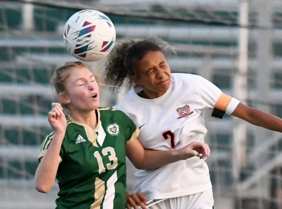 GlenOak's Addison Hamm and Green's Jillian Taylor fight for the ball, Wednesday, Sept 20, 2023.