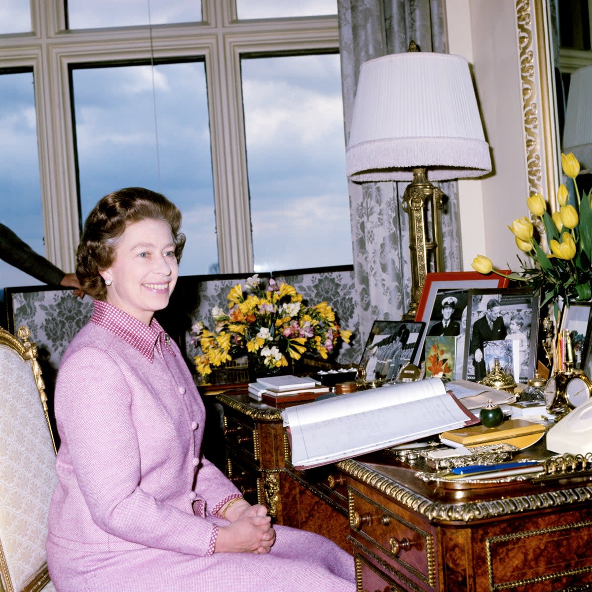 The Queen at her desk at Windsor castle in 1977 (PA) (PA Archive)