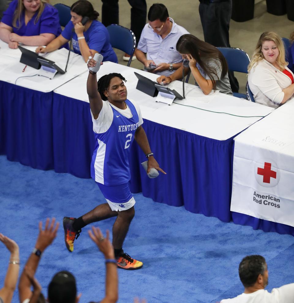 UK’s Sahvir Wheeler (2) acknowledges the crowd as they prepare to host a practice/scrimmage at Rupp Arena in Lexington, Ky. on Aug. 2, 2022 to raise relief funds for the victims of the floods in Eastern Kentucky.  