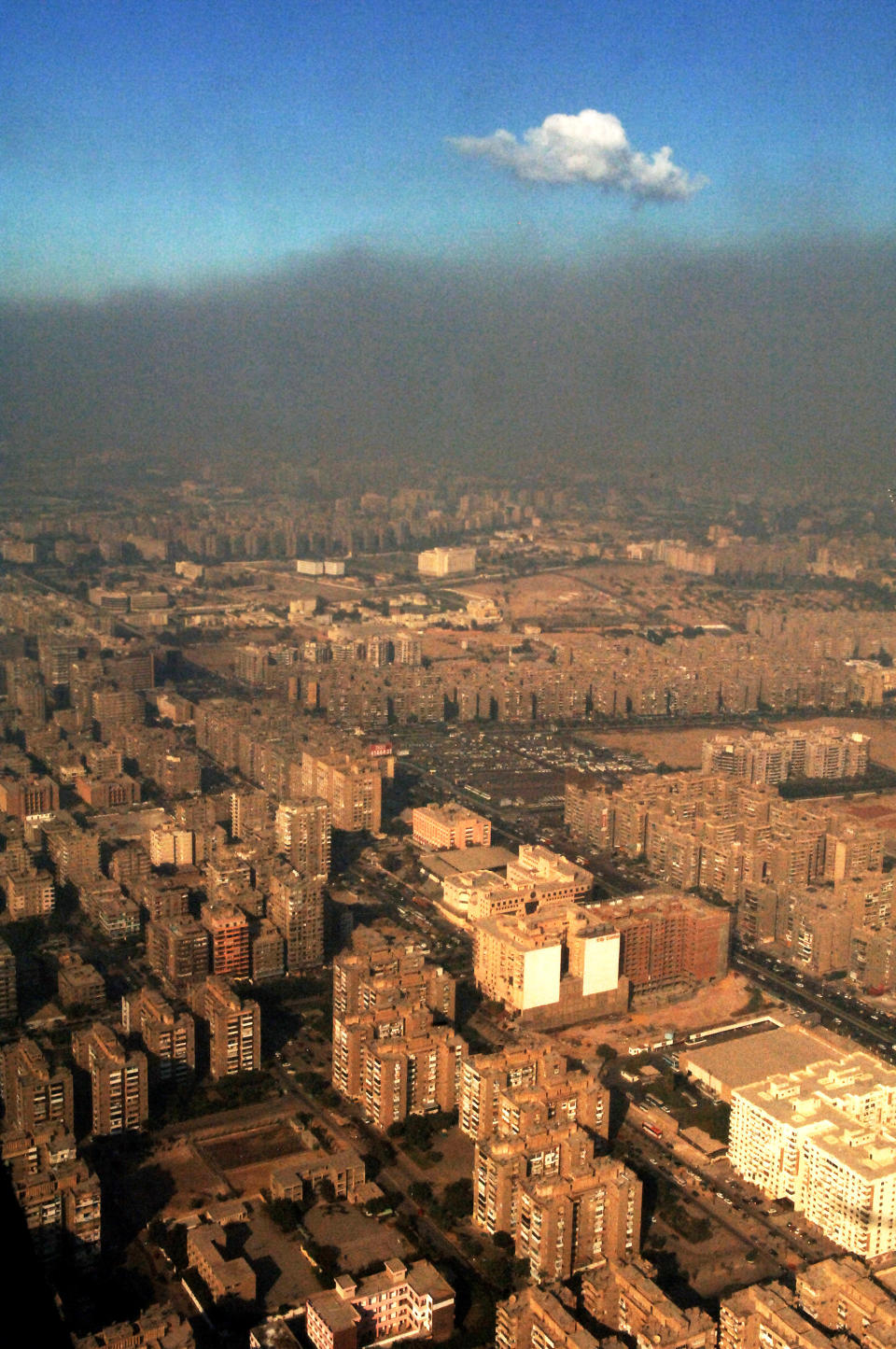 FILE - In this Sunday, Oct. 29, 2006 file photo, smog covers the city of Cairo, Egypt, where 2,000,000 cars on the streets and many unregistered lead and copper smelters heavily pollute. The Quran, Islam's holy book, is filled with more than 1,500 verses to nature and Earth. Yet the voice of Islamic leaders is missing from the global dialogue on warming. The middle eastern nation of Qatar is hosting a U.N. conference where nearly 200 countries are trying to forge a joint plan to fight global warming, which climate activists say is the greatest modern challenge to mankind. (AP Photo/Geert Vanden Wijngaert, File)