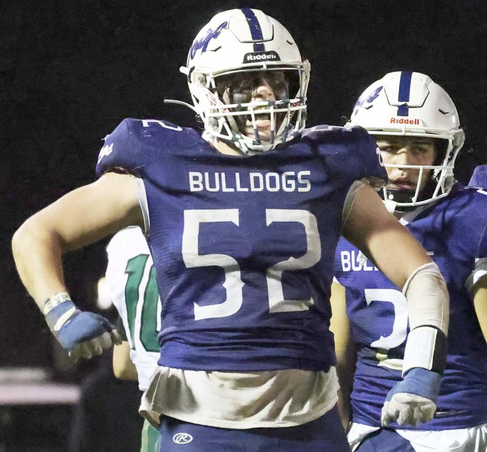 Rockland's Leary Costa celebrates his sack of Abington quarterback Michael Reilly during a game on Friday, Nov. 11, 2022.