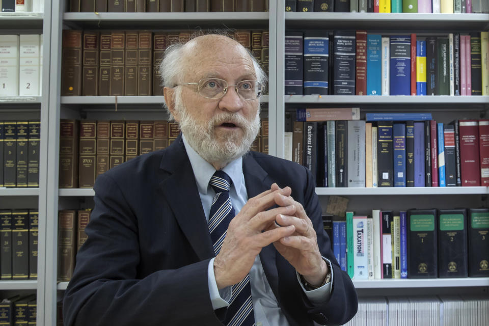 John Clancey, an American lawyer who became the first foreigner arrested under Hong Kong's national security law, speaks during an interview in Hong Kong, Friday, Jan. 15, 2021. Clancey said Friday that the courts now have a choice between the new law and the city's legally enshrined freedoms, as China cracks down on dissent in the Asian financial capital. (AP Photo/Kin Cheung)