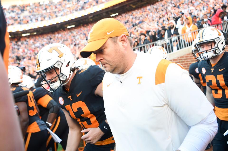 Tennessee head coach Josh Heupel runs onto the field before an SEC football homecoming game between the Tennessee Volunteers and the Georgia Bulldogs in Neyland Stadium in Knoxville on Saturday, Nov. 13, 2021.