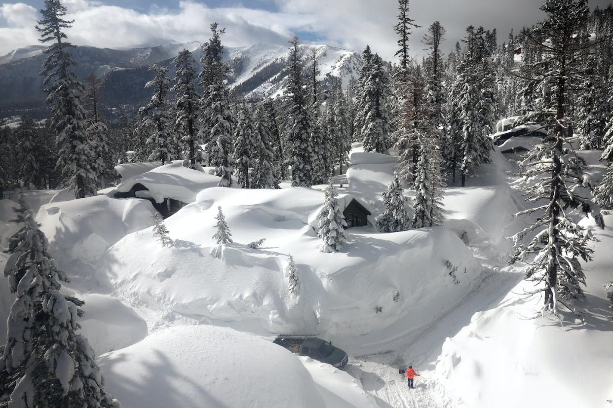 A series of atmospheric rivers in early 2023 covered the Sierra Nevada in snow. <a href="https://www.gettyimages.com/detail/news-photo/in-an-aerial-view-a-person-shovels-on-a-snowy-roadway-lined-news-photo/1473159767" rel="nofollow noopener" target="_blank" data-ylk="slk:Mario Tama/Getty Images;elm:context_link;itc:0;sec:content-canvas" class="link ">Mario Tama/Getty Images</a>