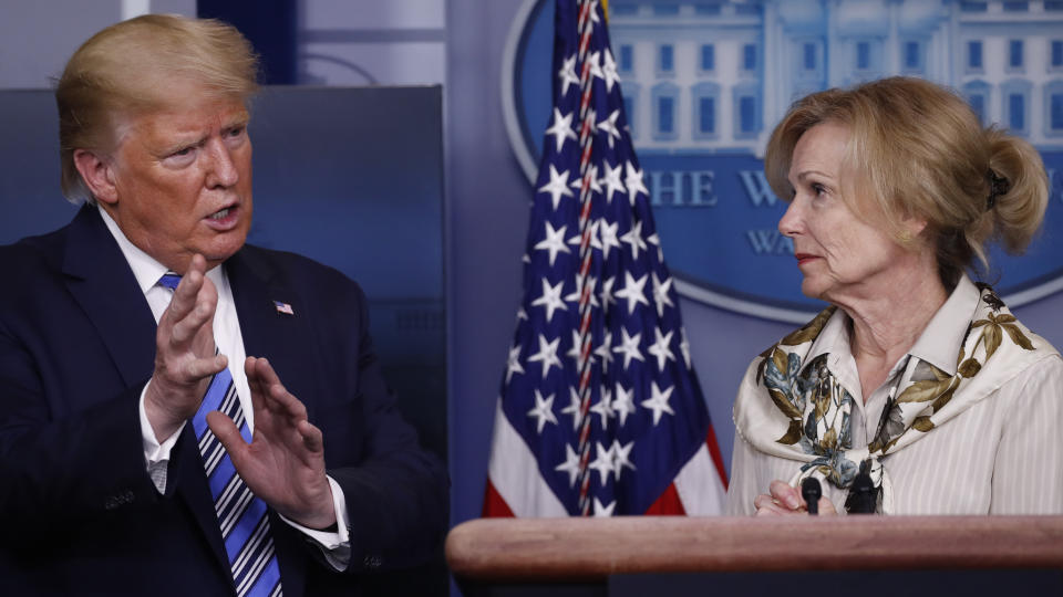 President Donald Trump asks a question to Dr. Deborah Birx, White House coronavirus response coordinator, during a briefing about the coronavirus in the James Brady Briefing Room, Monday, March 23, 2020, in Washington. (AP Photo/Alex Brandon)