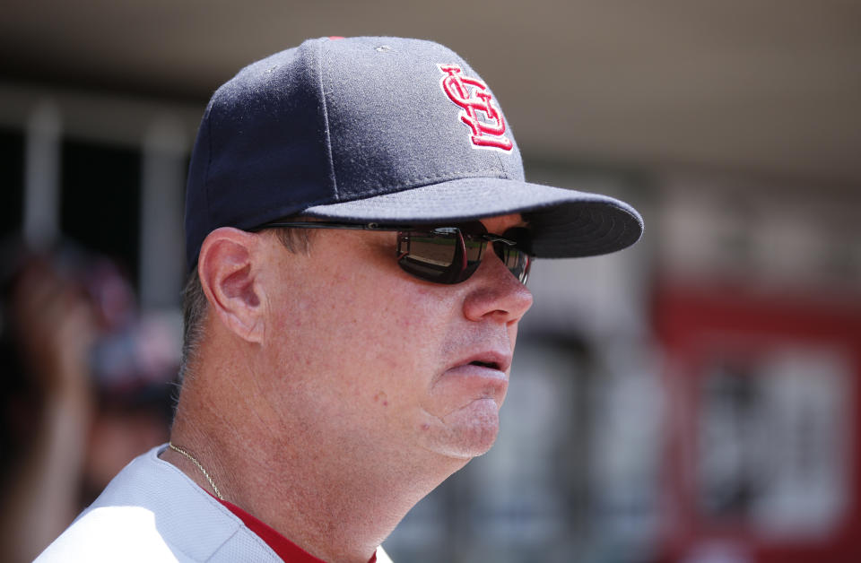 St. Louis Cardinals interim manager Mike Shildt (8) watches from the dugout during the first inning of a baseball game against the Cincinnati Reds, Wednesday, July 25, 2018, in Cincinnati. (AP Photo/Gary Landers)